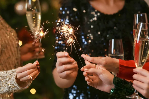 Beautiful Young Women Sparklers Glasses Champagne Celebrating Christmas — стоковое фото