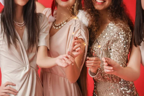 Beautiful Young Women Sparklers Celebrating Christmas Color Background — Stockfoto