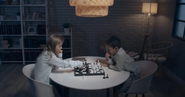 Little Children Playing Chess Home Evening — Video Stock