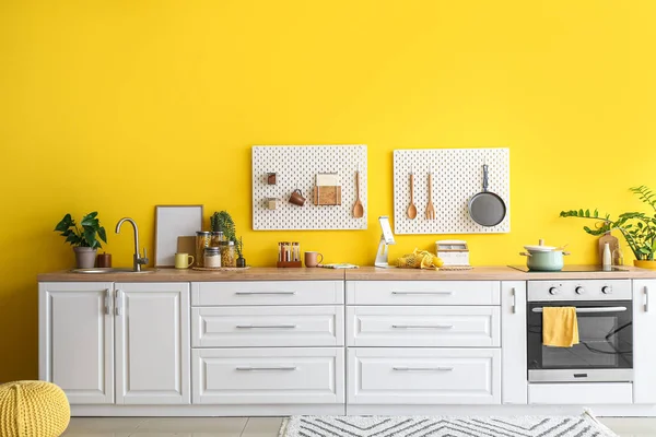Interior Stylish Kitchen White Counters Peg Boards Yellow Wall — Zdjęcie stockowe