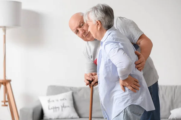 Senior Woman Walking Stick Suffering Back Pain Her Husband Home — Stock Photo, Image