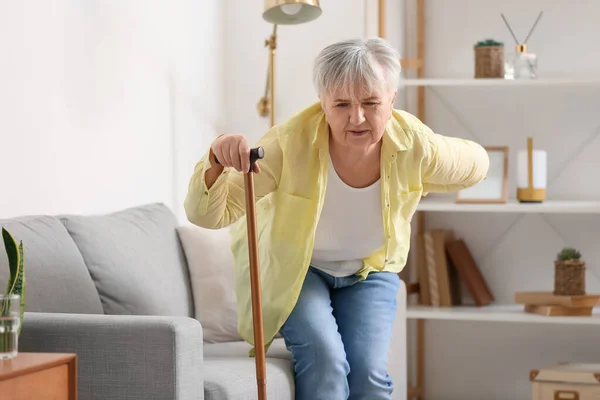 Senior Woman Walking Stick Suffering Back Pain Home — Stockfoto