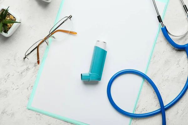 Asthma Inhaler Clipboard Eyeglasses Stethoscope Light Background Closeup — 스톡 사진