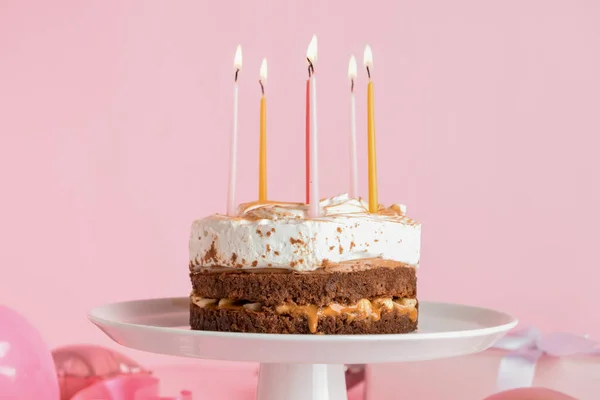 Stand Tasty Birthday Cake Burning Candles Pink Background — ストック写真