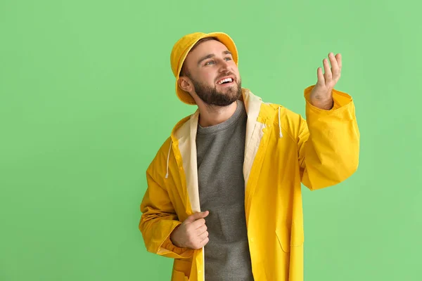 Young Man Stylish Raincoat Showing Something Color Background — Fotografia de Stock