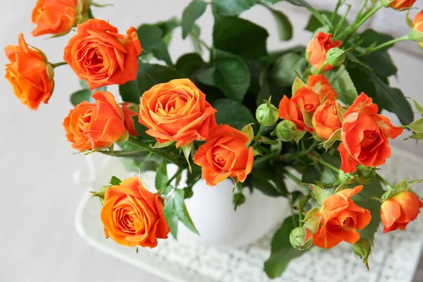 Jug Beautiful Orange Roses Table Closeup — Stock Photo, Image