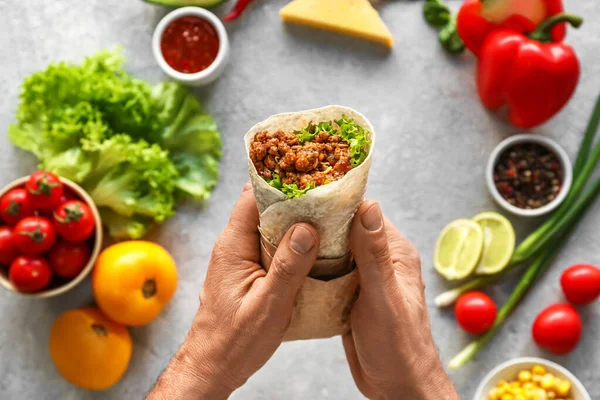 Man Tasty Burrito Ingredients Grey Background — Stock Photo, Image