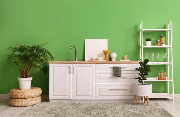 Interior Stylish Kitchen White Counters Shelving Unit Green Wall — Foto Stock
