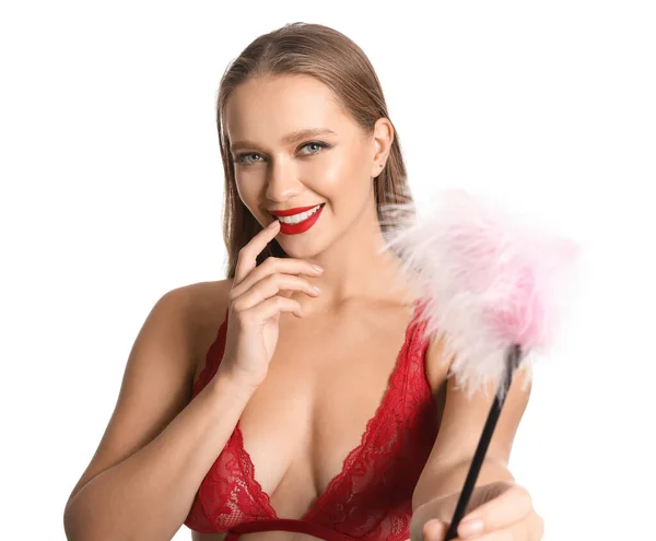 色彩艳丽的女人 带着羽毛棒从白色背景的性商店里出来 — 图库照片