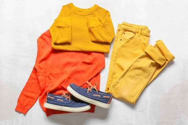 Stylish Children Sweaters Pants Shoes Light Background — Fotografia de Stock