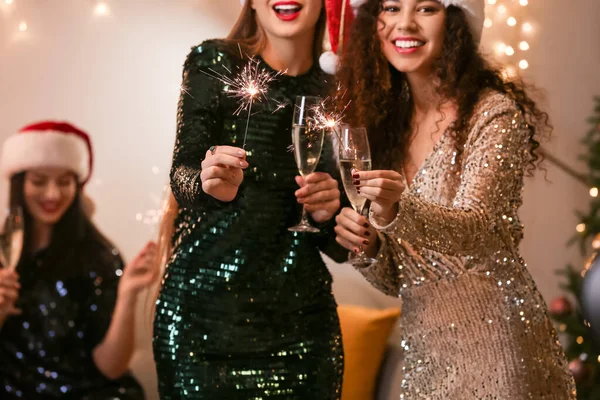 Beautiful Young Women Sparklers Glasses Champagne Celebrating Christmas Home — Stockfoto