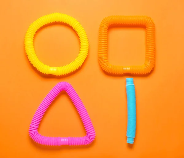 Pop Tubes Orange Background — Stock Photo, Image