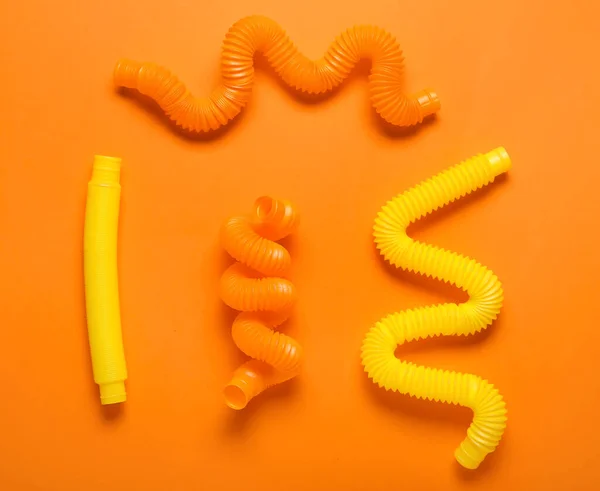 Pop Tubes Orange Background — Stock Photo, Image