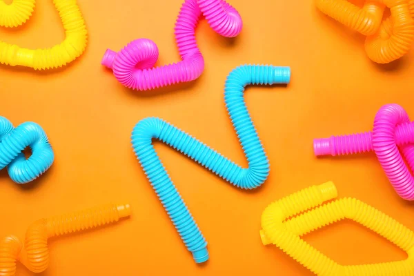 Pop Tubes Orange Background — Stock Photo, Image