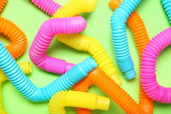 Pop Tubes Green Background — Stock Photo, Image