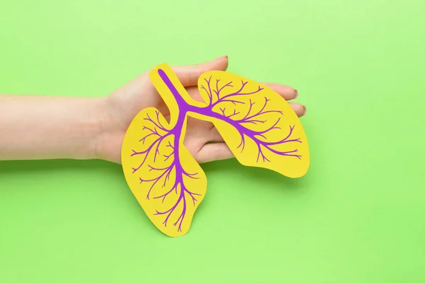 Female Hand Holding Paper Lungs Green Background — 스톡 사진