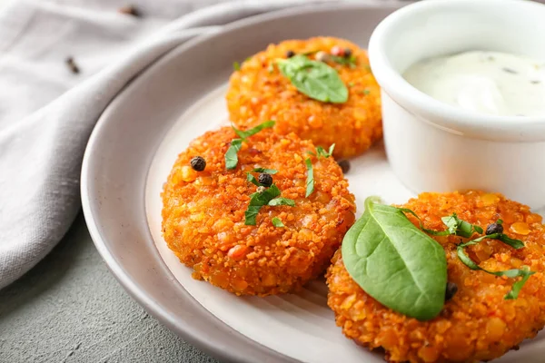 Plate Tasty Lentil Cutlets Sauce Grey Background Closeup — Stock Photo, Image