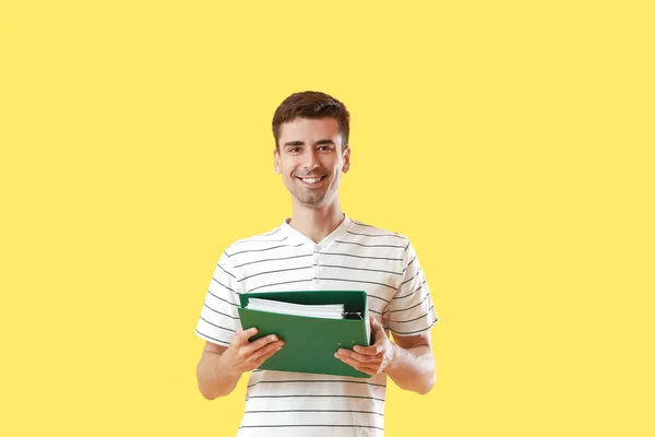 Young Man Folder Yellow Background — Zdjęcie stockowe