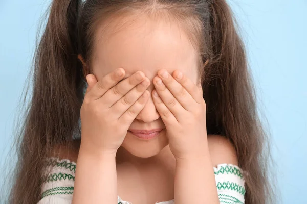 Little Girl Ponytails Closing Eyes Blue Background Closeup — Stock Photo, Image
