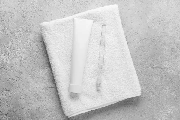 Tube Tooth Paste Brush Towel Grey Background — стоковое фото