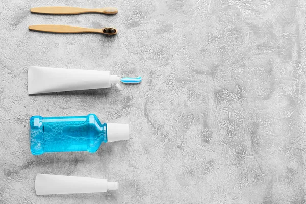 Tubes Tooth Paste Brushes Mouthwash Grey Background — Foto Stock