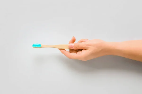 Female Hand Holding Tooth Brush Paste White Background — 스톡 사진