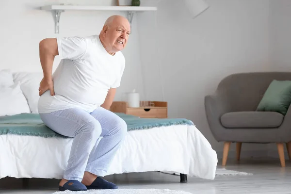 Senior Man Suffering Back Pain Bed Home — Stockfoto