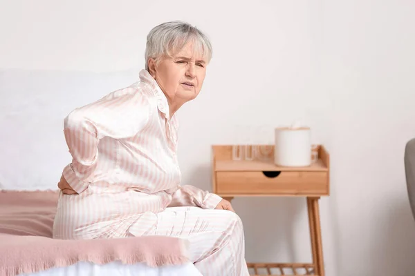 Senior Woman Suffering Back Pain Bed Home — Stockfoto
