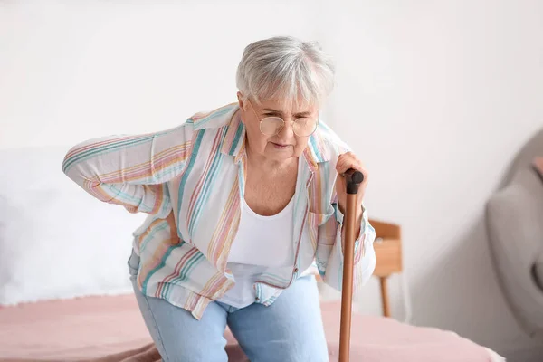Senior Woman Walking Stick Suffering Back Pain Bedroom — Stock Fotó