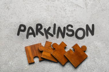Grunge arkaplanında yapboz parçaları olan kelime parkı.
