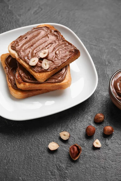 Plate Bread Chocolate Paste Hazelnuts Black Background — Stock Photo, Image