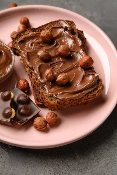 Plate Bread Chocolate Paste Hazelnuts Grey Background Closeup — Stock Photo, Image