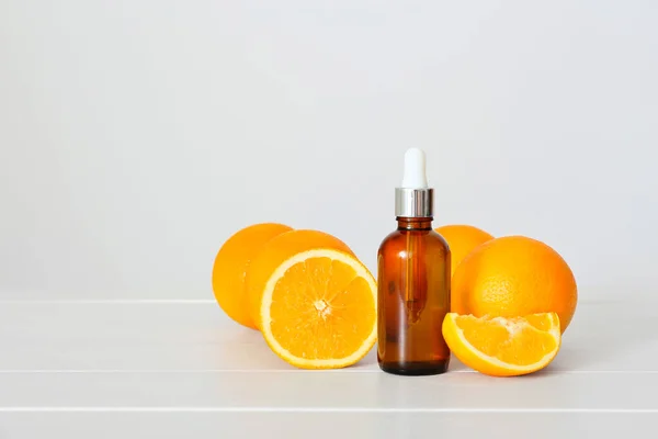 Bottle Essential Oil Fresh Oranges Light Wooden Table — Stock Photo, Image