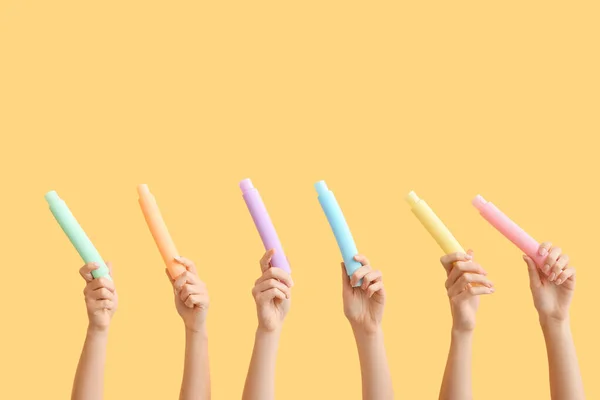 Hands Popular Pop Tubes Color Background — стоковое фото