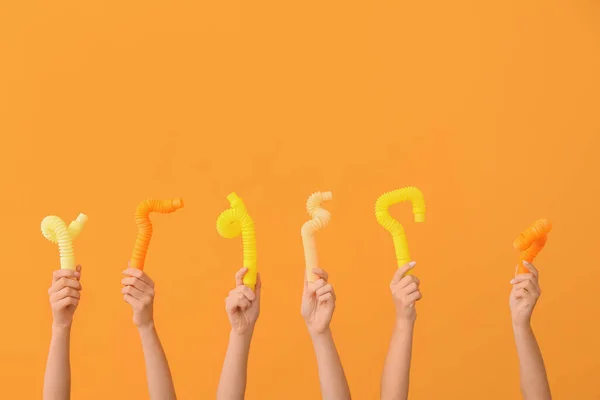 Hands Popular Pop Tubes Color Background — Stock Photo, Image