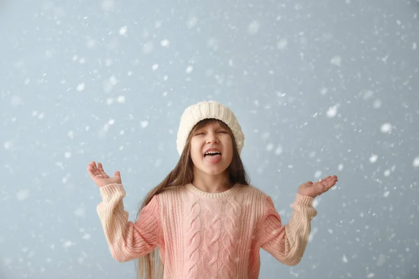 Cute Little Girl Winter Clothes Catching Falling Snow Tongue Grey — Fotografia de Stock