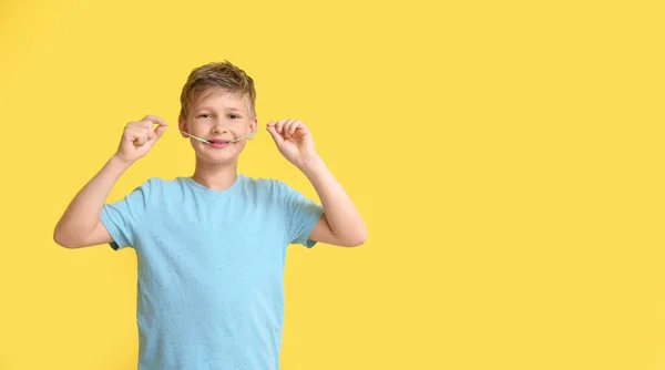 Little Boy Blue Shirt Chewing Gum Yellow Background — Stock Photo, Image