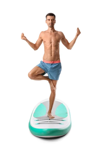 Sporty Young Man Meditating Sup Board White Background — Stockfoto