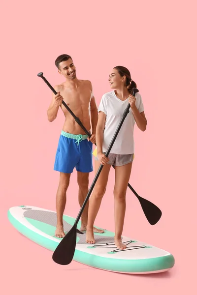 Young Couple Board Sup Surfing Color Background — Stock Photo, Image