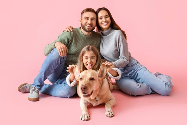 Happy Parents Little Daughter Labrador Dog Pink Background — стоковое фото