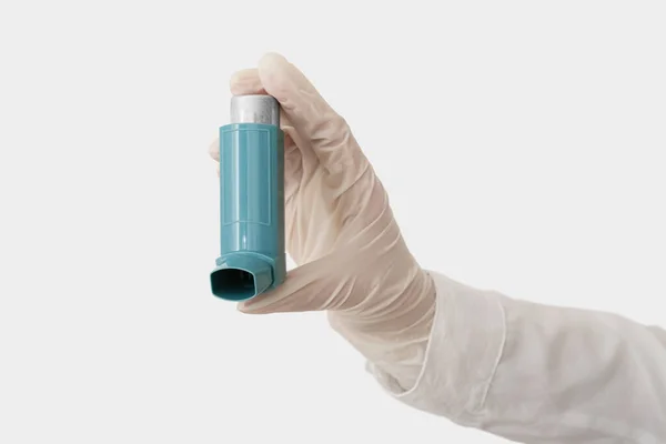 Woman Holding Asthma Inhaler Light Background — Stockfoto