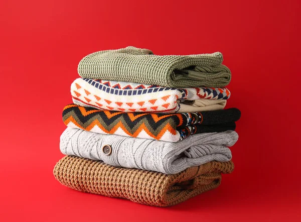 Stack Different Sweaters Red Background — Fotografia de Stock