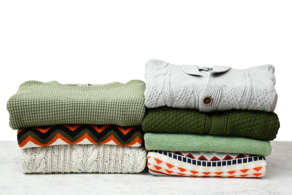 Stacks Stylish Sweaters Table Light Background — Fotografia de Stock