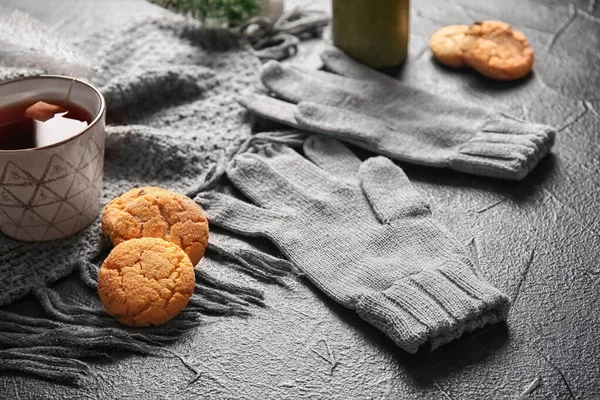 Warm Gloves Cup Tea Cookies Black Background — Stock Fotó