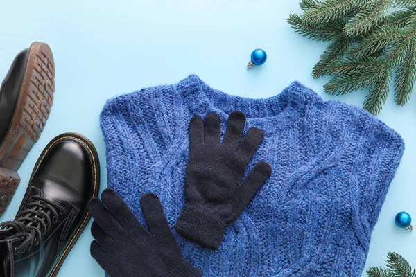 Stylish Winter Clothes Shoes Christmas Decor Blue Background Closeup — Stockfoto