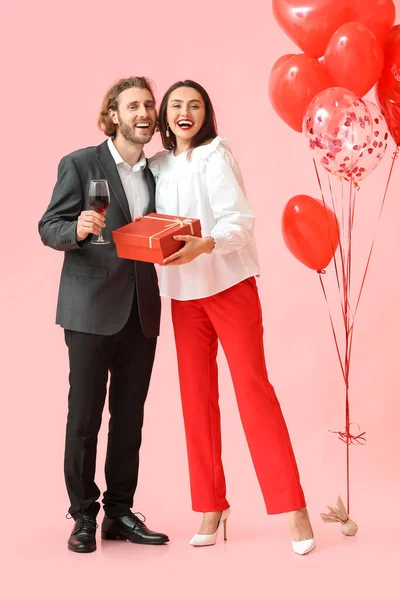 Happy Young Couple Wine Gift Balloons Color Background Valentine Day — стокове фото