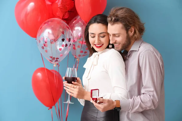 Young Man Proposing His Girlfriend Color Background Valentine Day Celebration — Stock Photo, Image