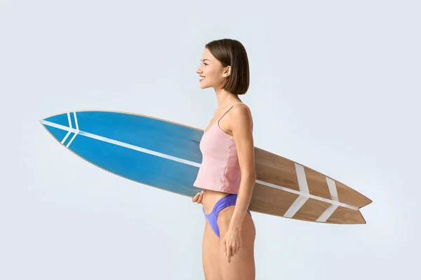 Beautiful Young Woman Surfboard Light Background — Zdjęcie stockowe