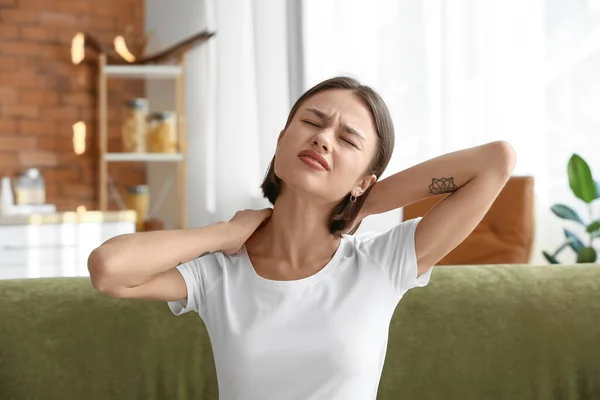 Young Woman Feeling Neck Pain Home — 图库照片