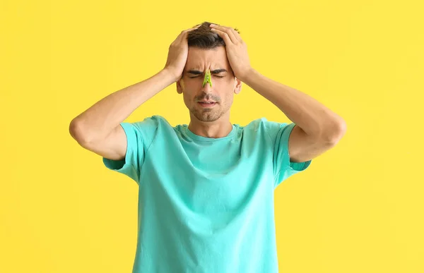 Ill Young Man Clothespin His Nose Color Background — Stock Photo, Image